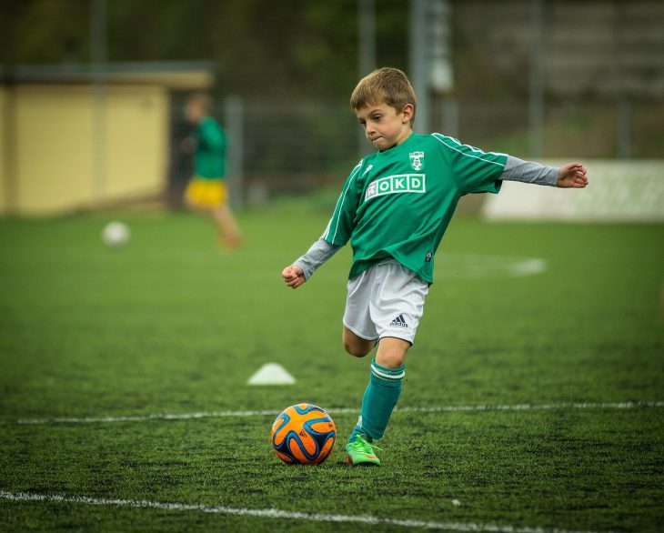 photo of child with soccer ball