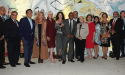A group of community leaders, artists, and advocates—including Dr. Dorothy Caram and Houston Mayor Sylvester Turner—pose together at the ALMAAHH kick-off event. The group stands in front of a colorful mural, celebrating the launch of Houston’s Latino museum and cultural arts initiative.