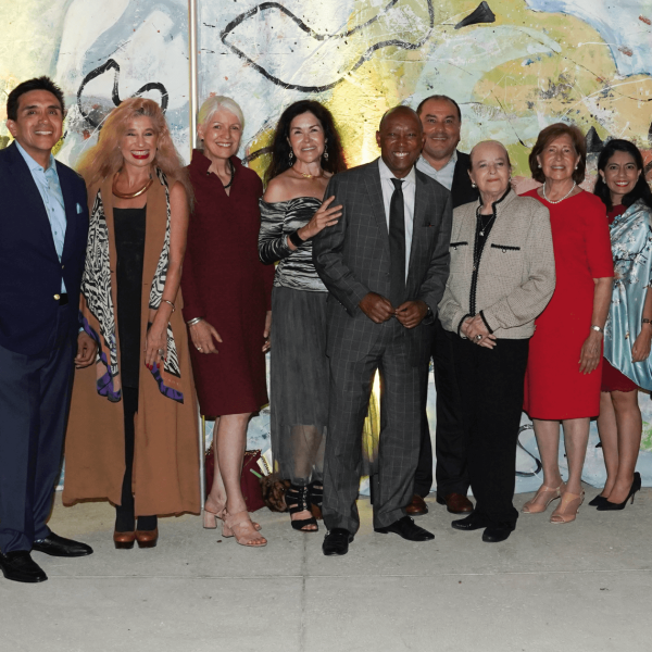 A group of community leaders, artists, and advocates—including Dr. Dorothy Caram and Houston Mayor Sylvester Turner—pose together at the ALMAAHH kick-off event. The group stands in front of a colorful mural, celebrating the launch of Houston’s Latino museum and cultural arts initiative.